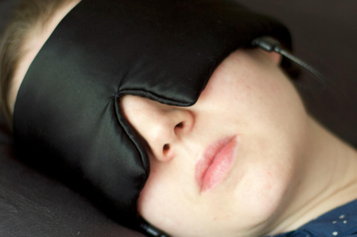 31st St Project audio sleep mask Black sleep mask with two detachable short-lead earbuds and a separate control module.